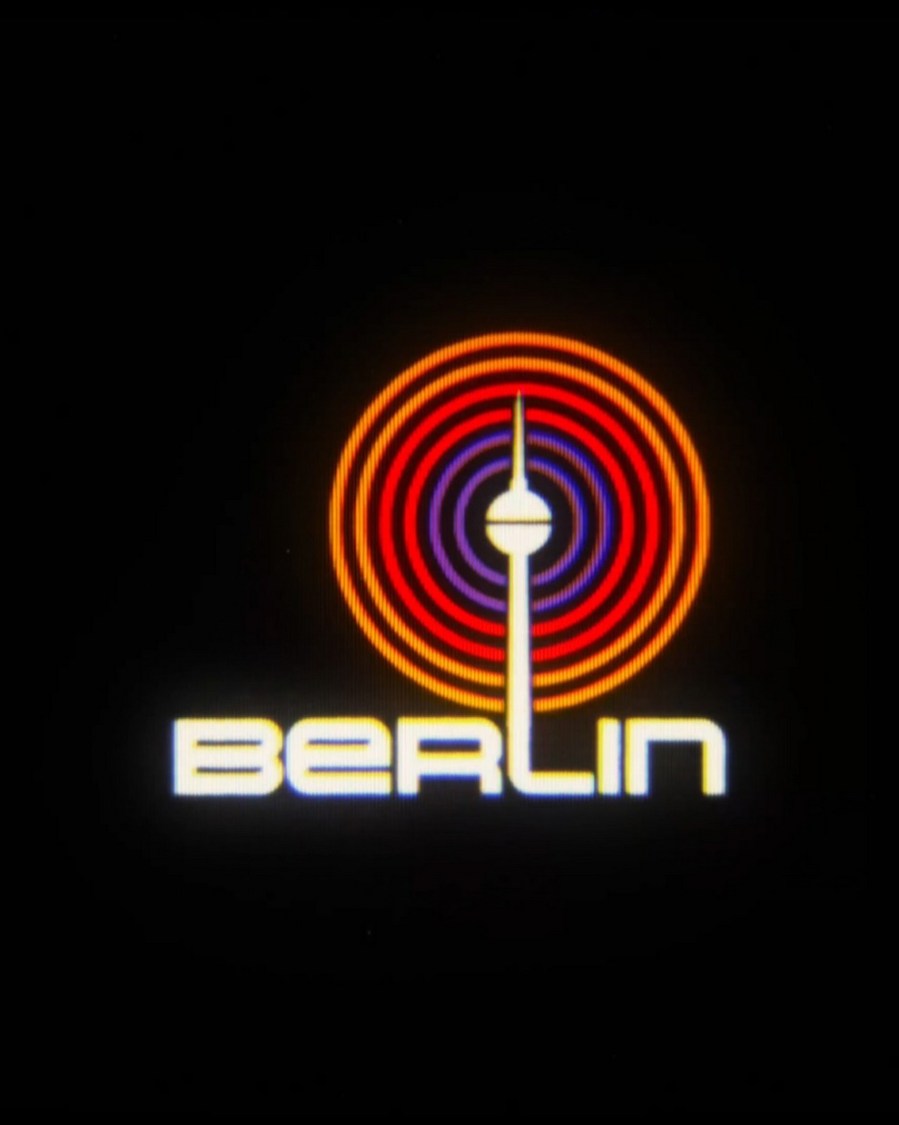 Retro 80s style pixel city logo