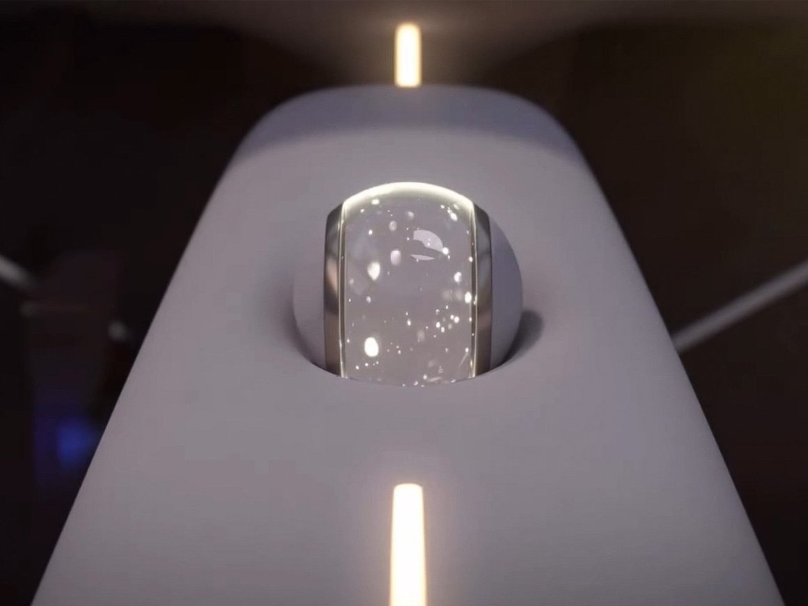 A close-up of a crystal ball-like control interface set in a futuristic dashboard design, featuring a sleek white surface with glowing lines.