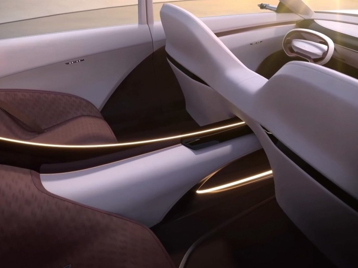 Interior view of the Buick Electra Orbit concept, showcasing a modern and futuristic dashboard design with a minimalist aesthetic.