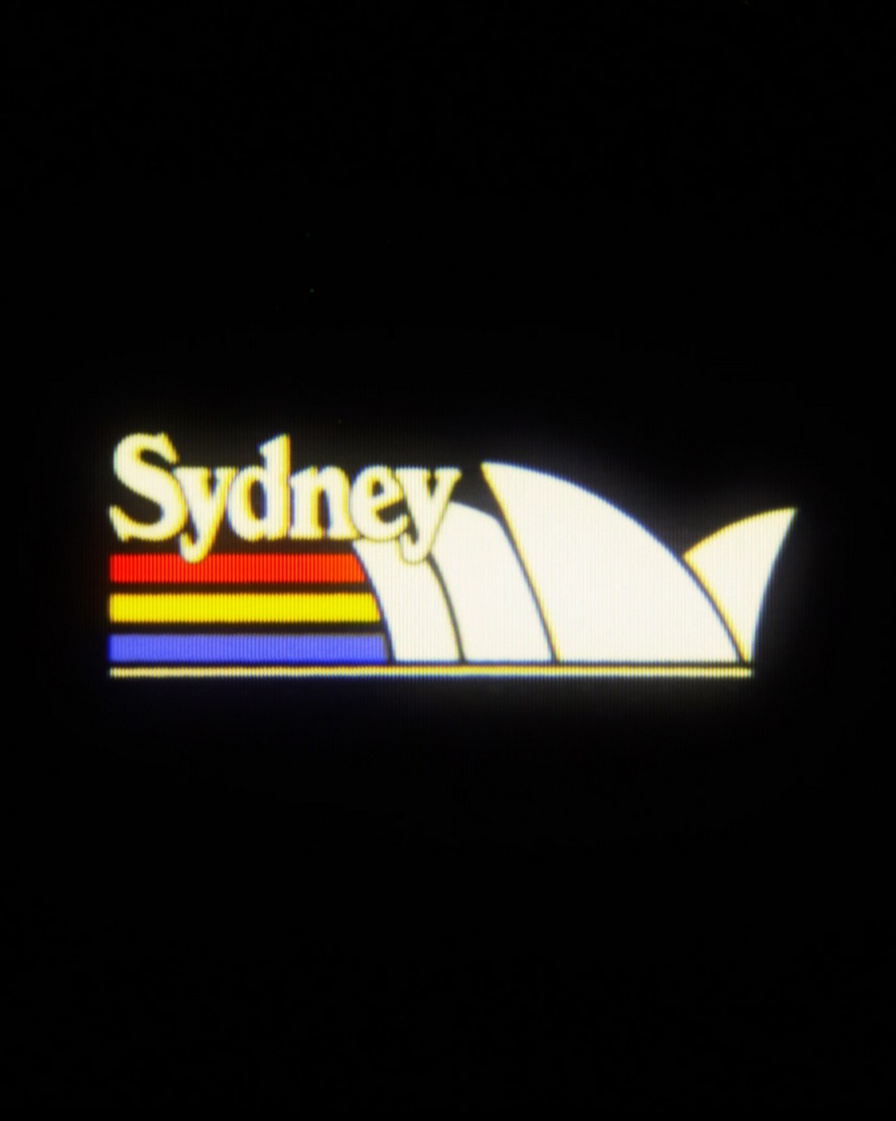 Logo featuring the word 'Sydney' with stylized graphics of the Sydney Opera House and colorful stripes.