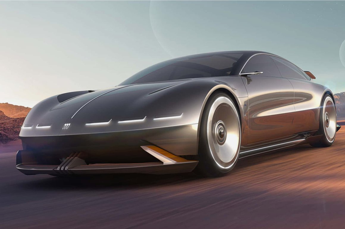 A futuristic Buick Electra Orbit concept car with a sleek, aerodynamic design, showcasing LED headlights and a prominent hood emblem, set against a desert background.