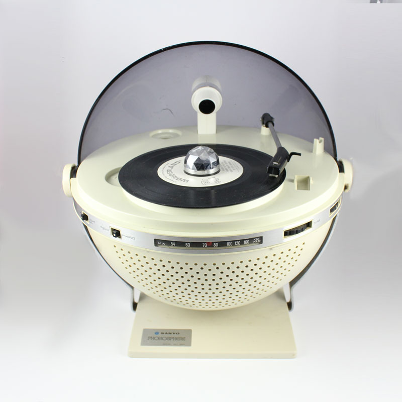 A vintage Sanyo record player with a dome cover, featuring a turntable, tonearm, and control panel.