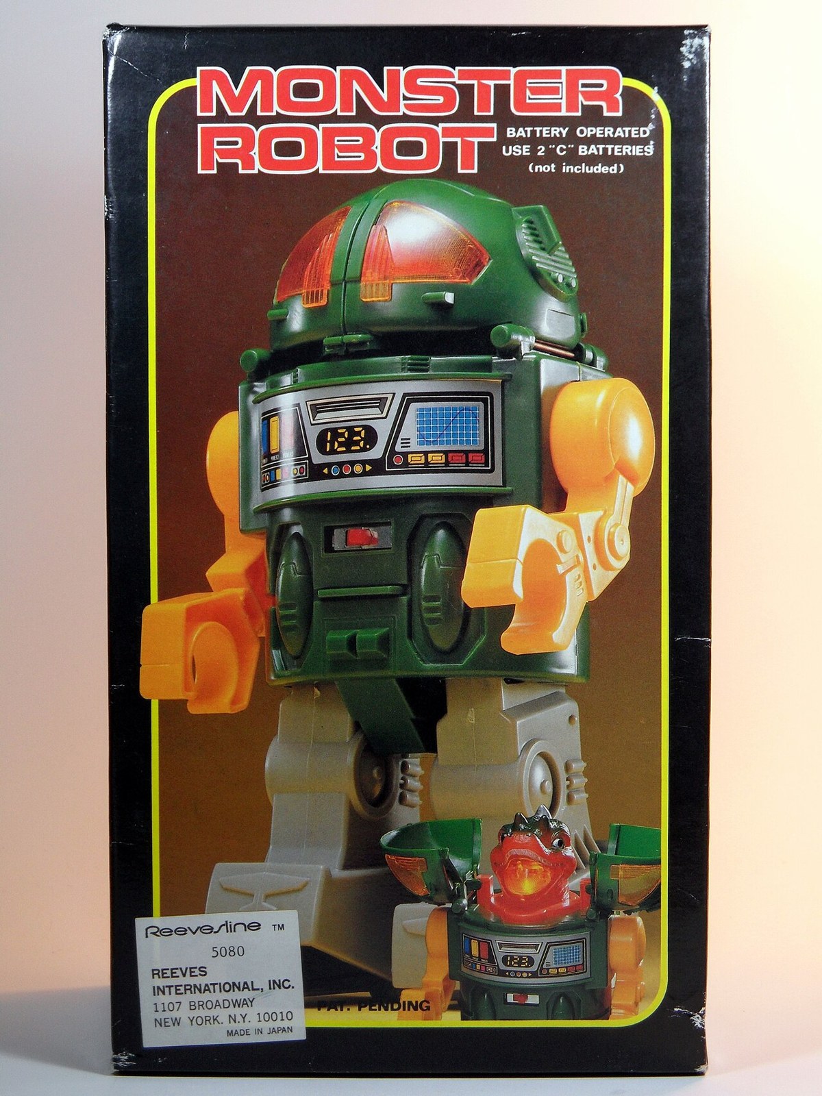 Black box for a battery operated Monster Robot toy, with a chunky green, yellow and red robot with a digital display panel in its chest and the title MONSTER ROBOT in red outlined letters